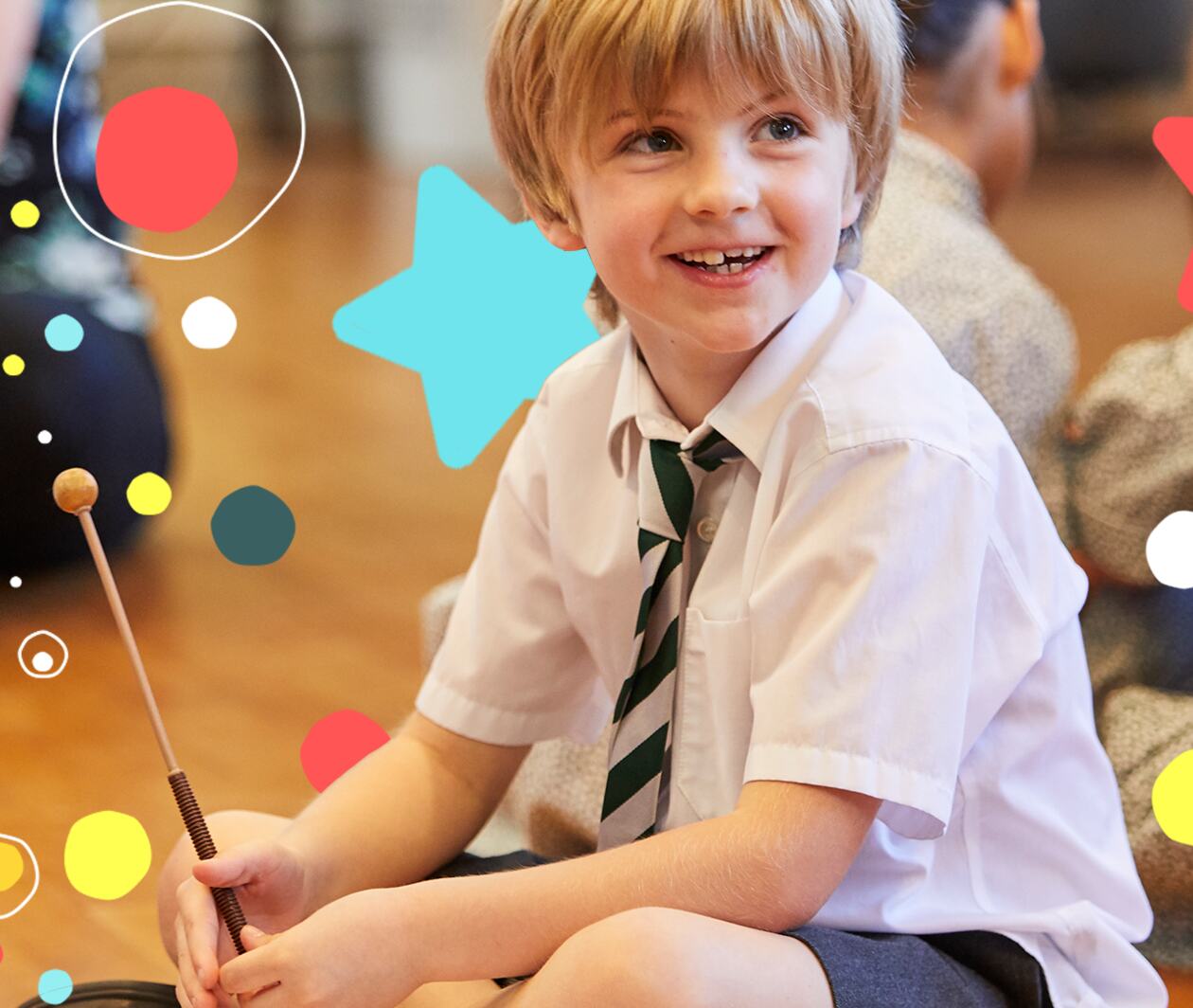 Child in classroom making music with Classroom 200