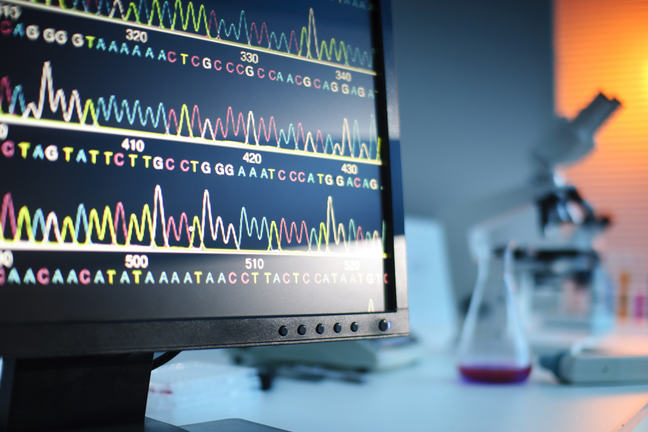 Image of genetic sequence on the screen within a lab