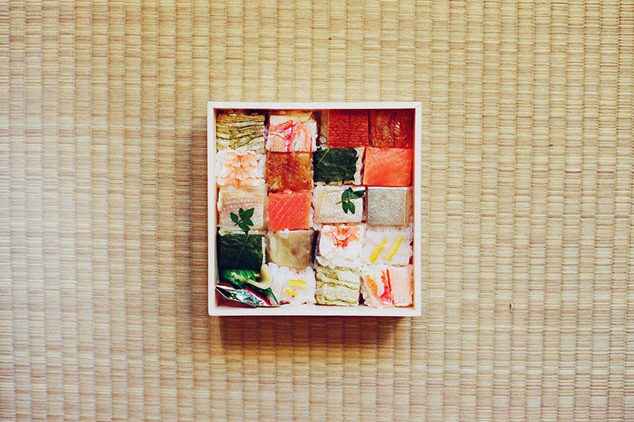 Directly Above Shot Of Various Sushi In Bento Box On Tatami Mat