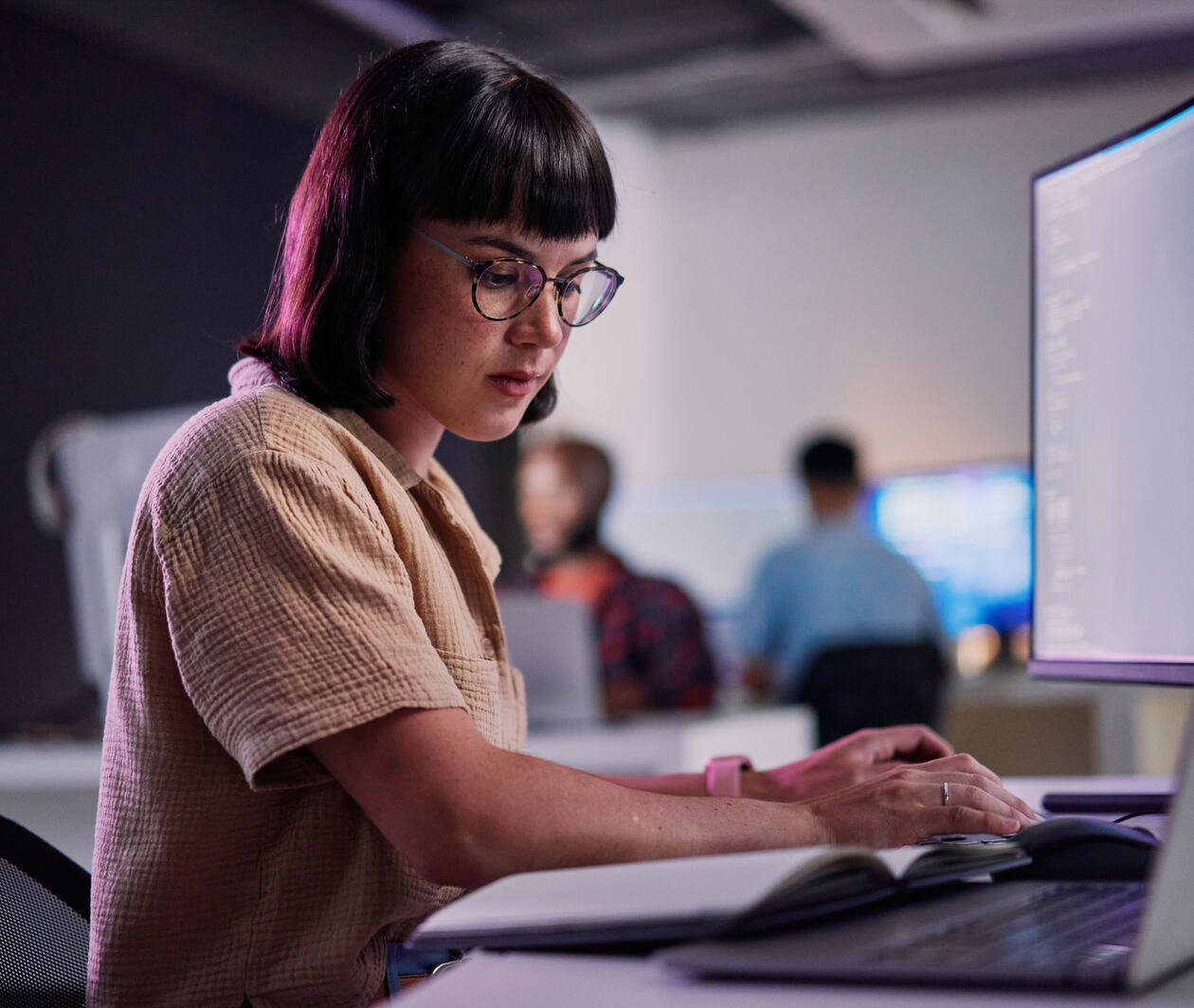 Serious, computer screen professional and coding for software engineering, developer or designer. Cyber security, data science and code with employee in office for neon, website or technology