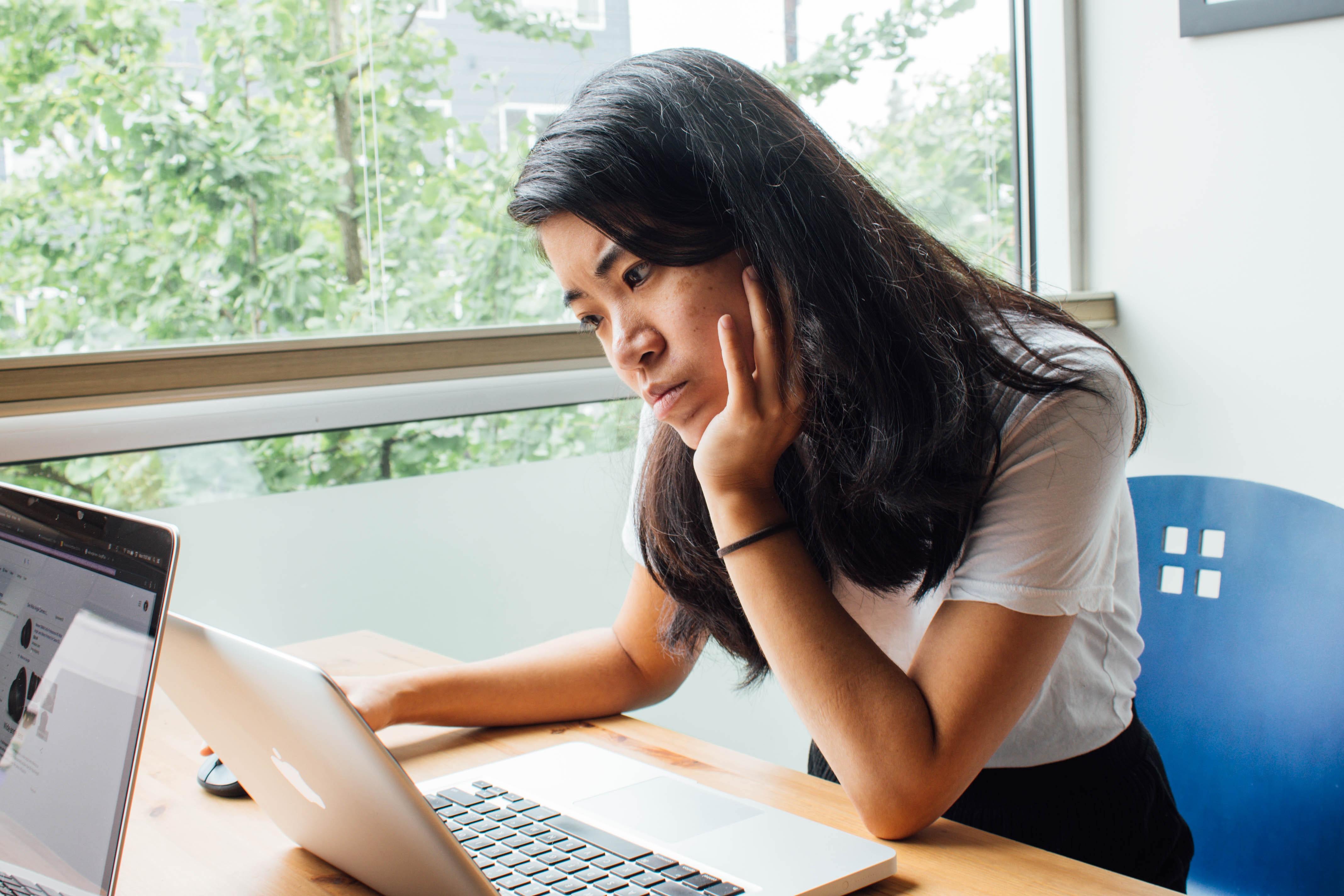 student looking confused at computer screen