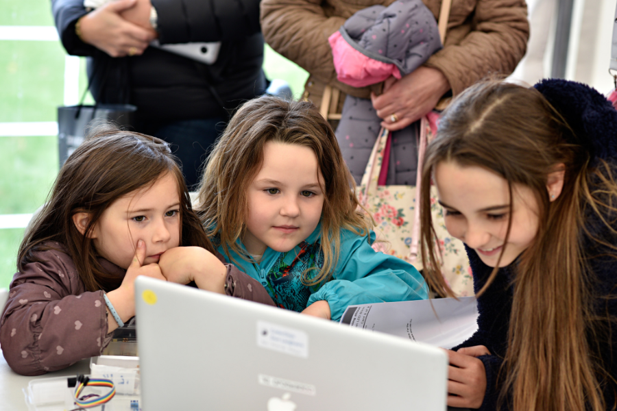 Three girls at a laptop