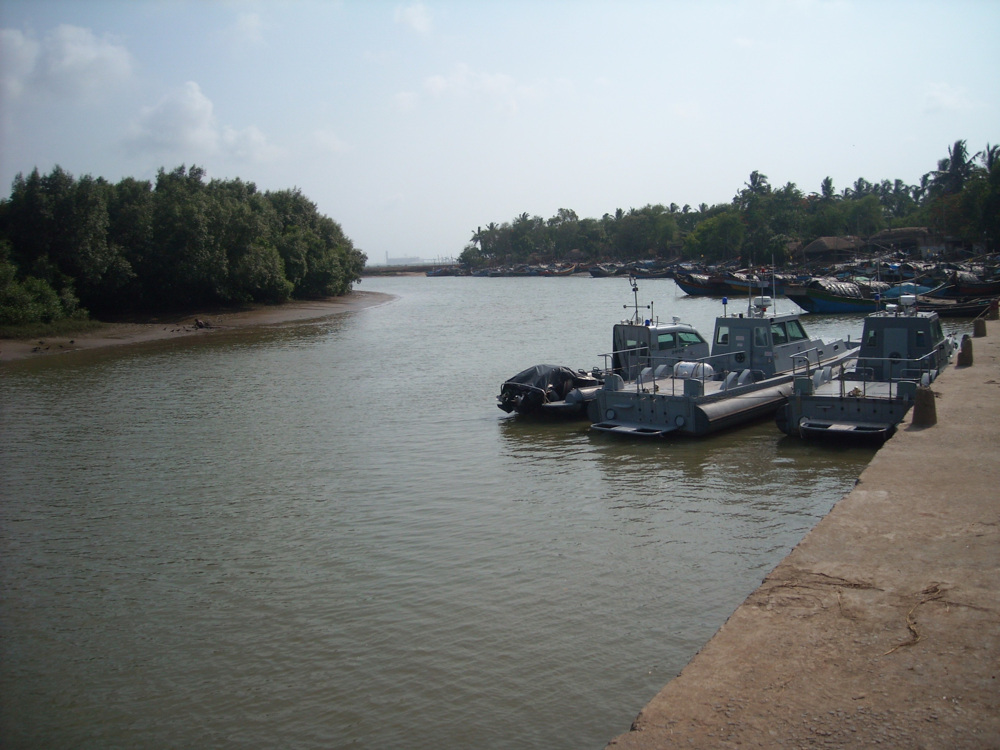 Boats moored at the side of a river