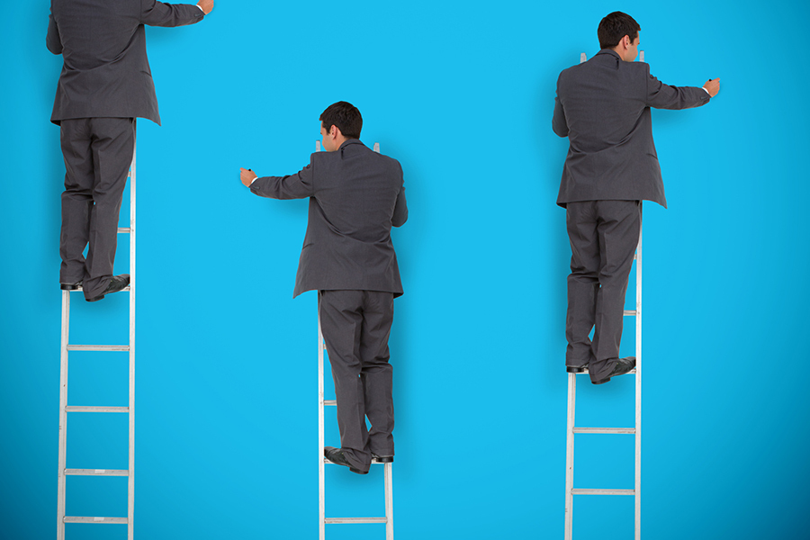 Multiple image of businessman writing something on a wall