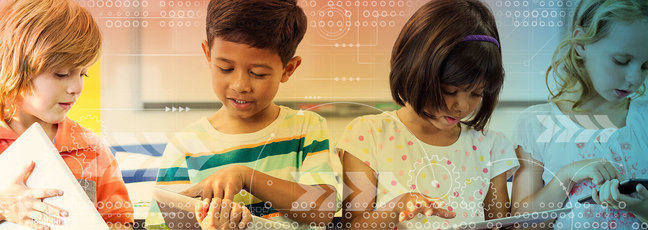 Four young students focused on creating ideas on their tablets