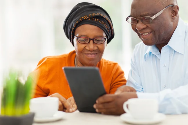 Mature couple looking at a tablet together