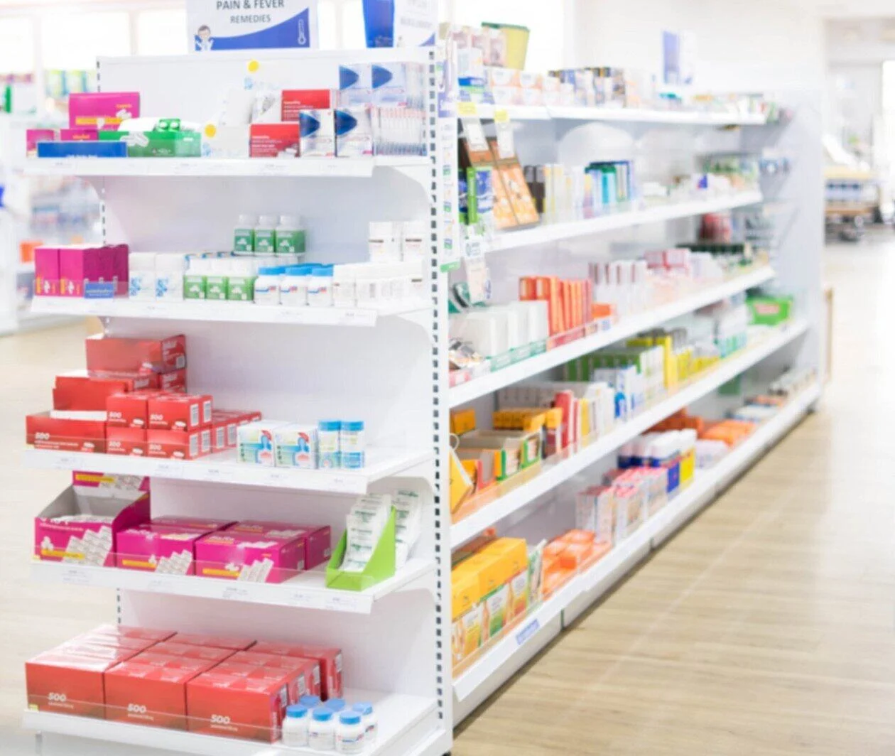 At the chemist, Medicines arranged in shelves, Pharmacy drugstore retail Interior blur abstract backbround with medicine and healthcare product on cabinet with ืneon light with vaccine.