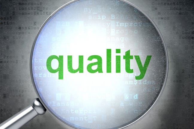 Magnifying glass zeroing in the word quality.