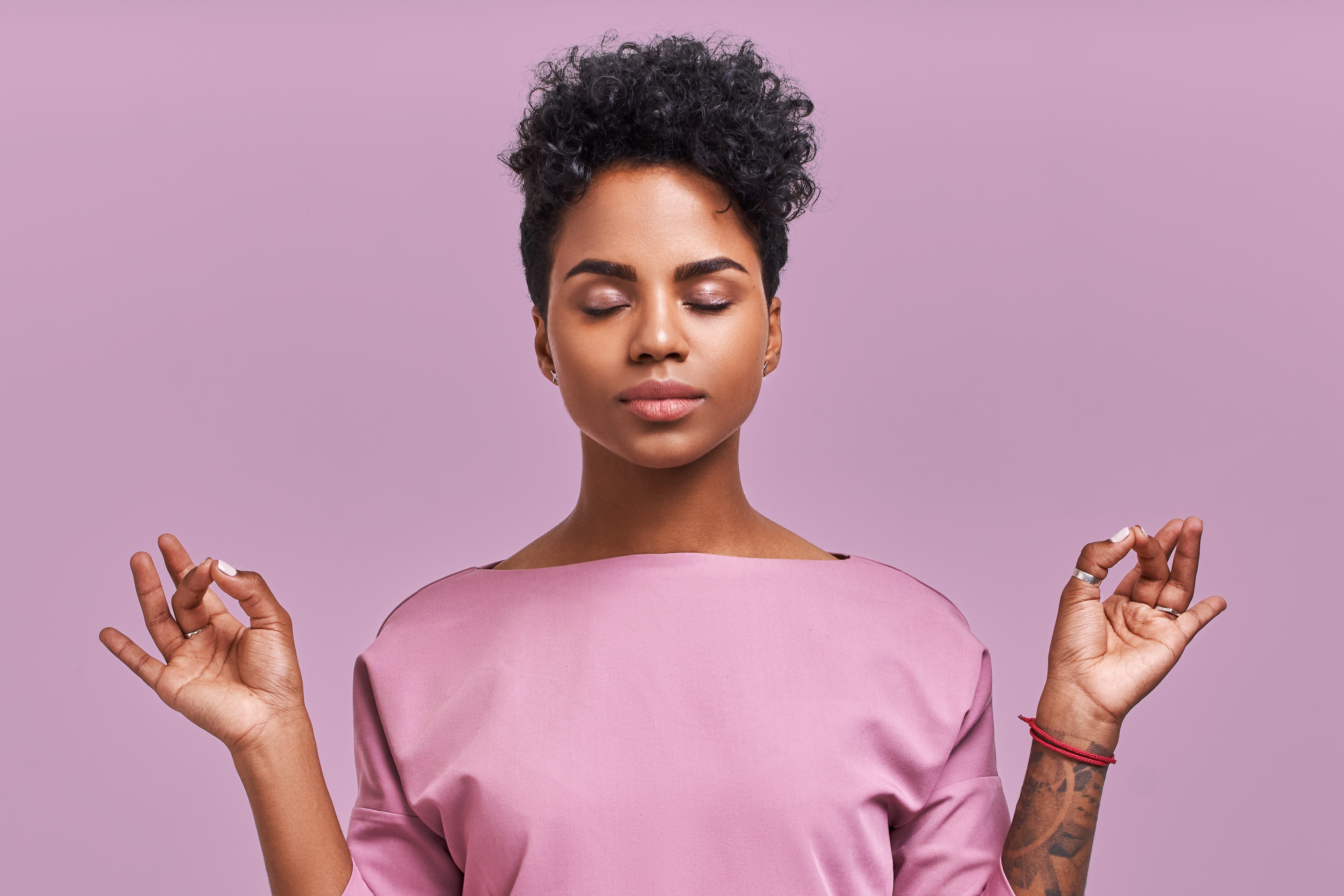 Woman meditating with her eyes closed