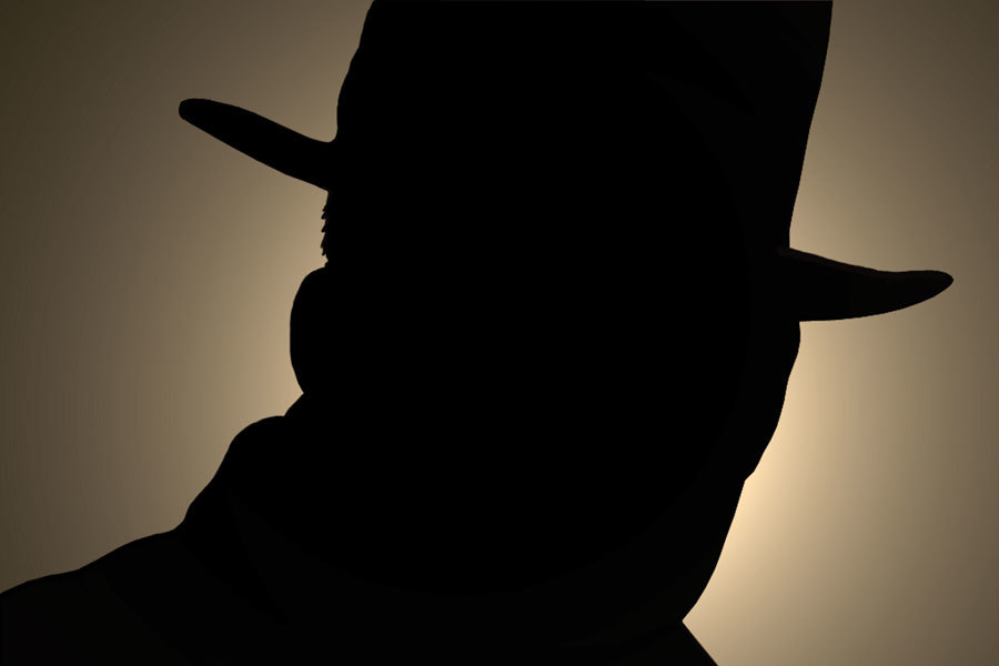 Silhouette of a man wearing a hat