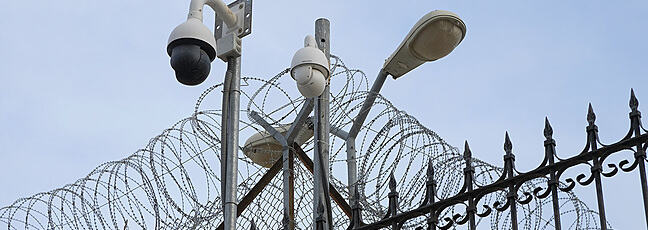 border with security cameras