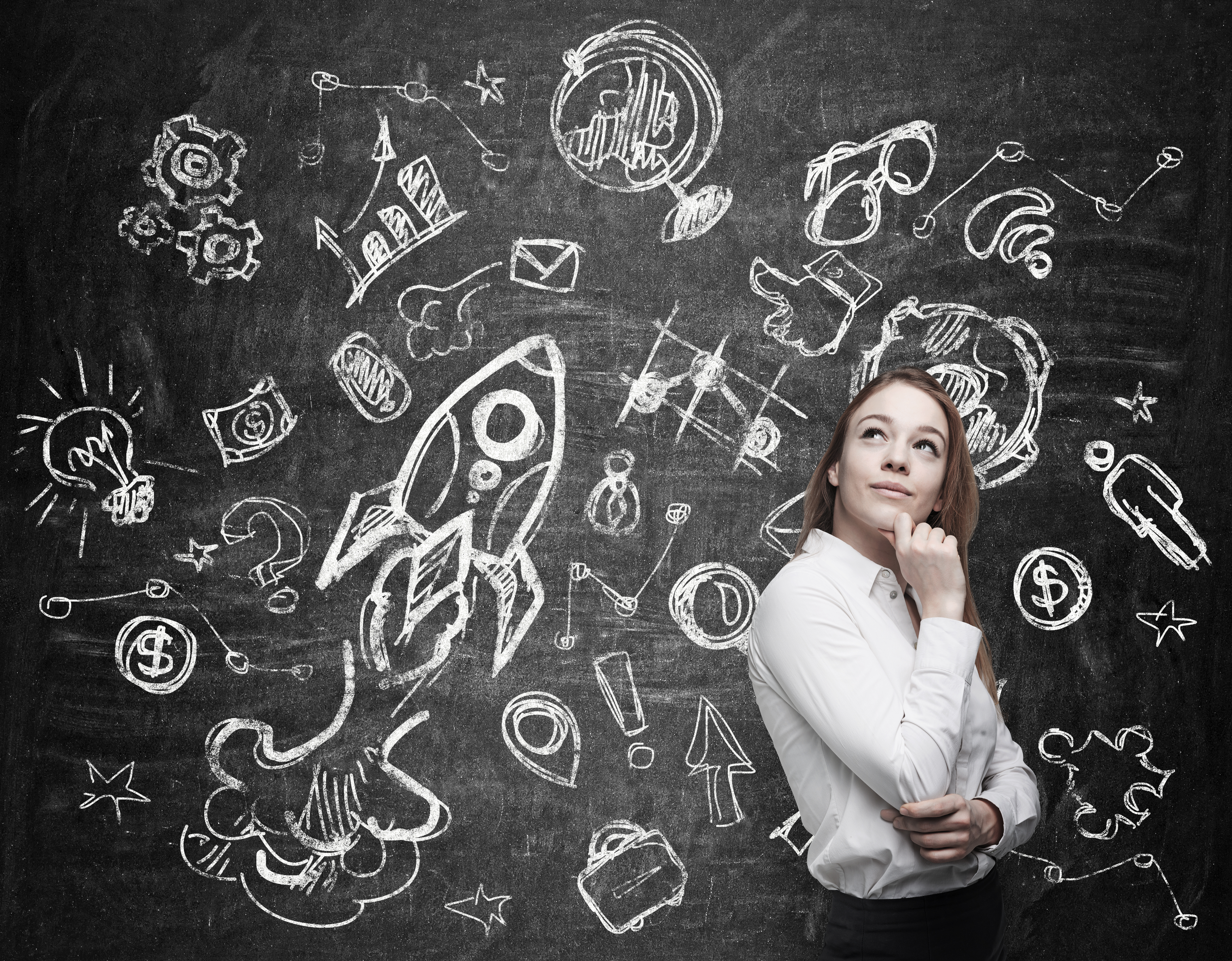 Young woman is thinking about future education opportunities by chalk board