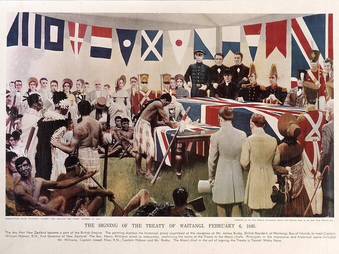 A collaged reconstruction of a painting representing the signing of the Treaty. Traditionally dressed Māori stand and sit around the edges with Europeans. At a large table draped in the union flag, representatives of both groups sign a document.