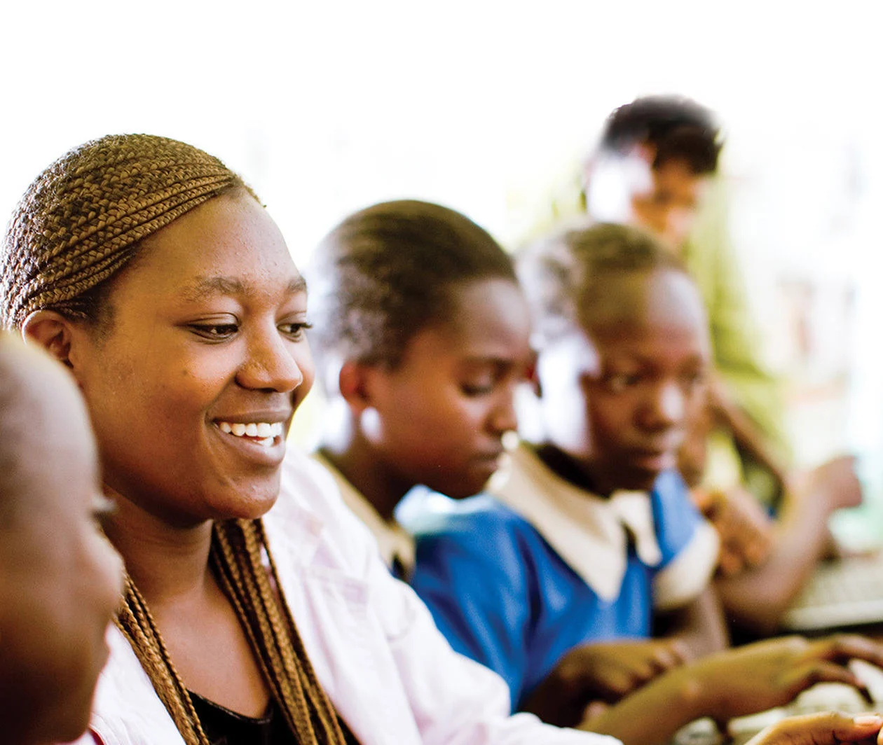 An English language teacher helps a pupil