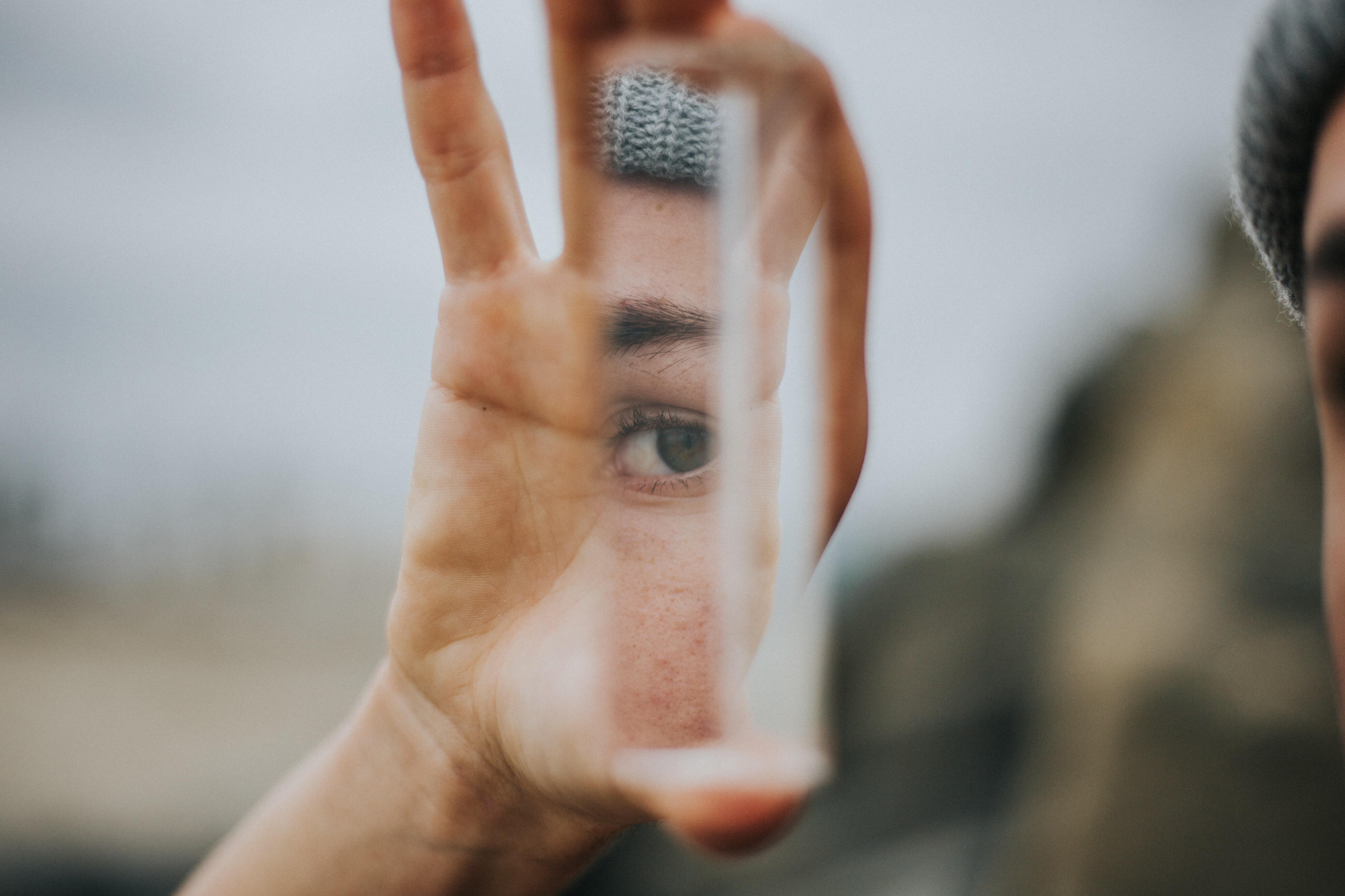 Reflection of a woman's eye in a crystal