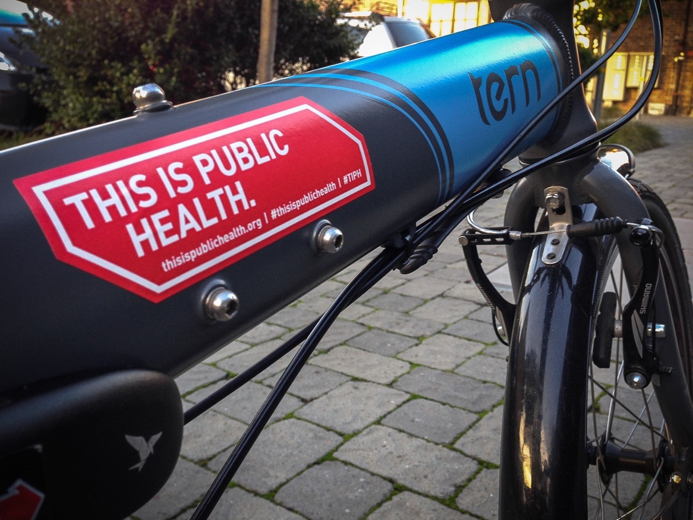 A bike displaying the slogan 'this is public health'.