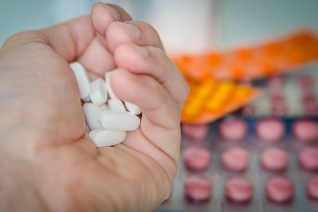 Hand holding antibiotics.