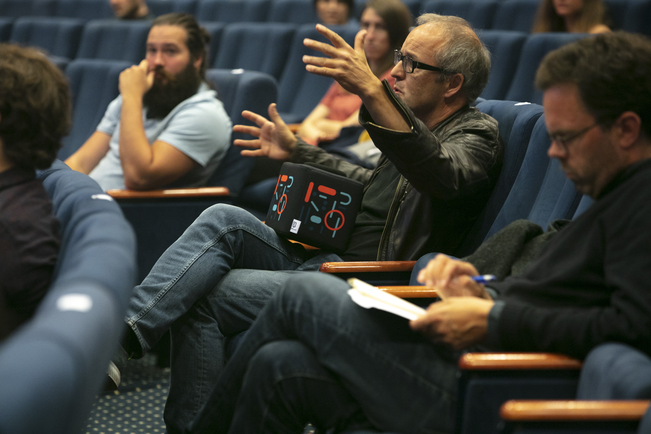 Person talking in an auditorium.