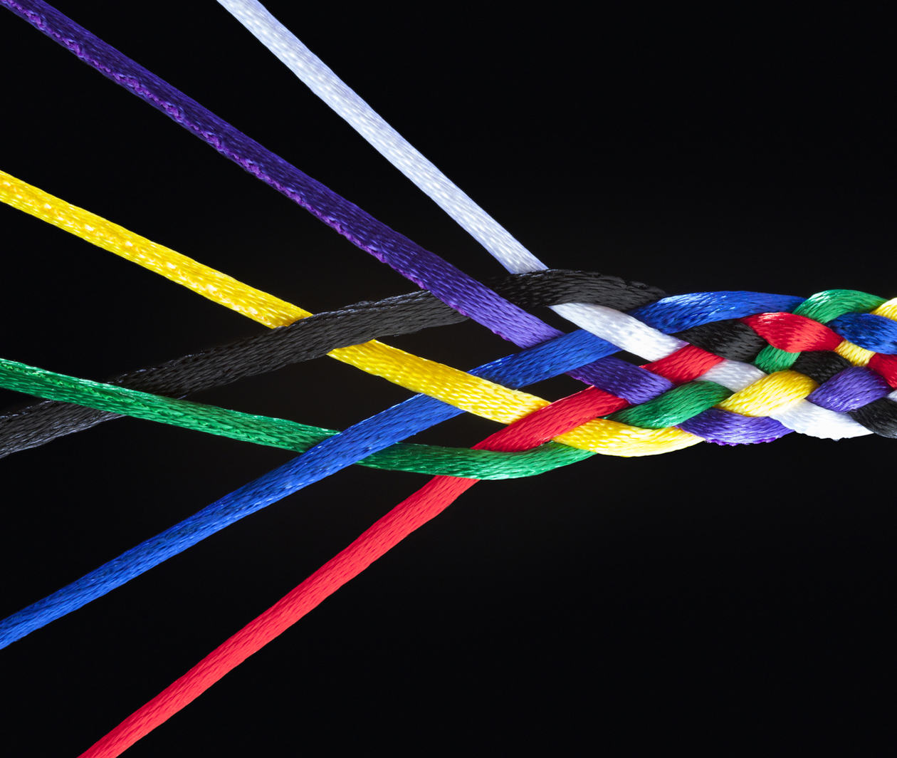 Strands of an interwoven multicoloured piece of rope