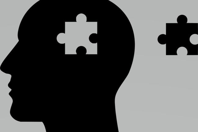 Silhouette of head and jigsaw piece