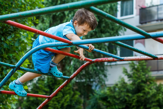 Boy on climbing frame