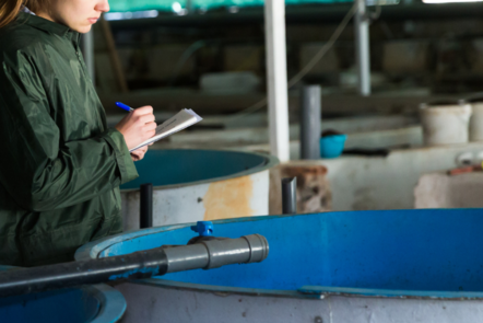 Worker taking notes and reporting on RAS 