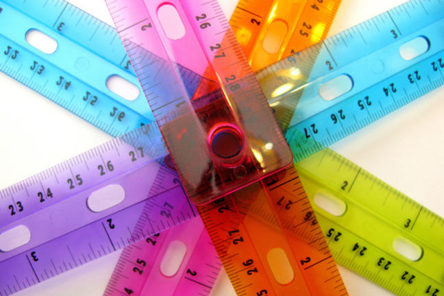 multicoloured tapes measures fanned out into the shaper of a star
