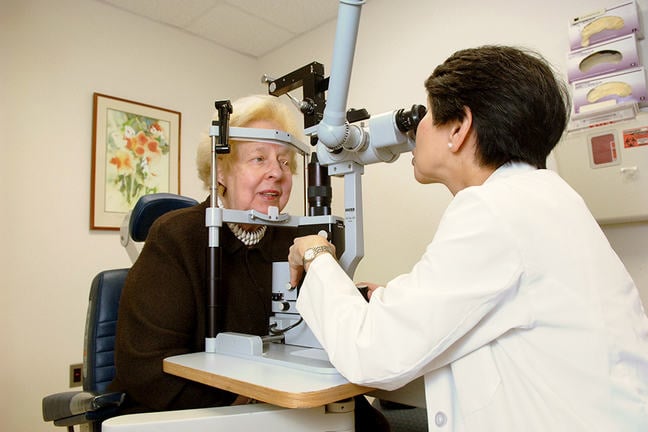 Woman having her retina examined in the clinic