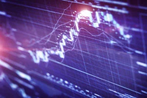 Close-up financial or trading chart in purple on a LCD display, showing the dots and lines moving upwards.