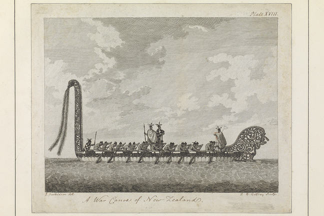 engraving in black and white of War canoe of New Zealand; figures with oars in the water sit and three figures with headdress and spears standing up. Canoe has tall wooden feature behind and the prow is intricately carved wood.