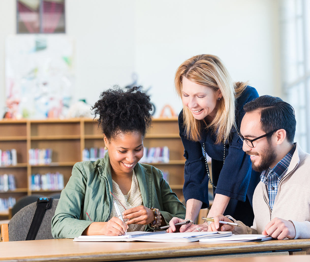 A group of people studying together and taking notes