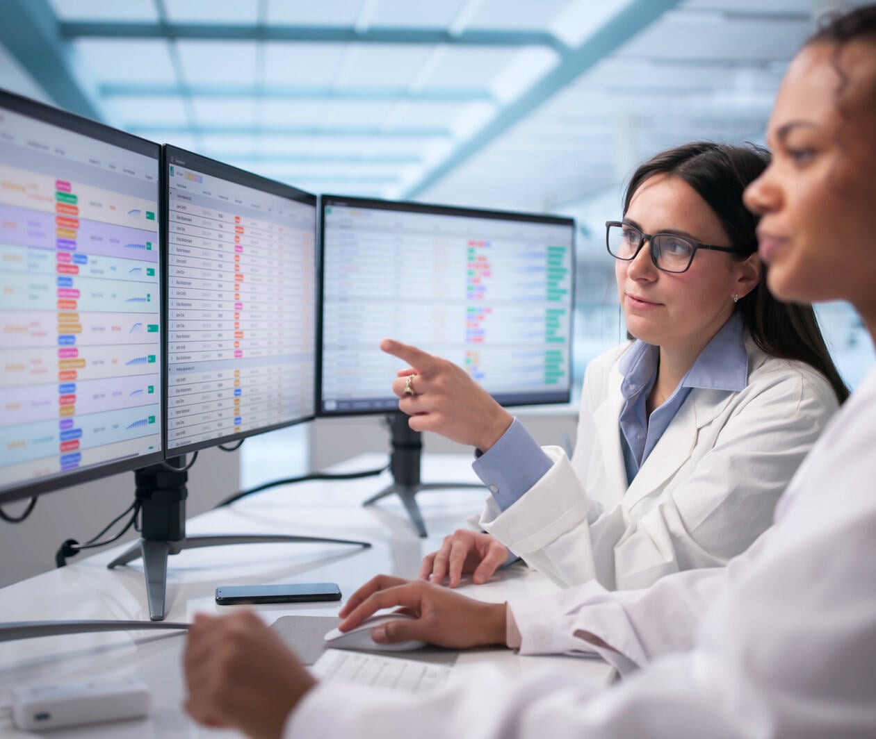 Female Doctor Analyzing Medical Data On Hospital Computer Monitor