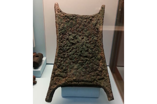 Oxhide-shaped copper ingot.
