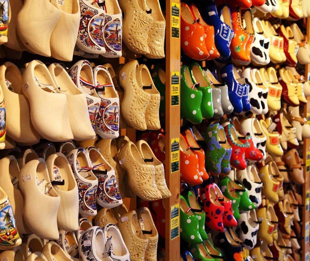 Lots of Dutch clogs hanging on a wall