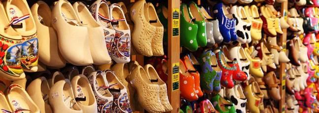 Lots of Dutch clogs hanging on a wall