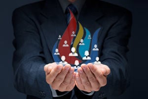 eFIRE: a businessman holding in his hands icons representing team members, surrounded by coloured flames.
