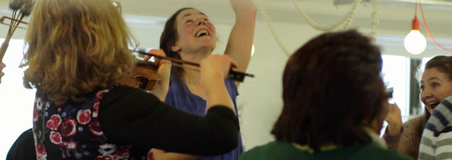 Photograph of people participating in a dance and music session