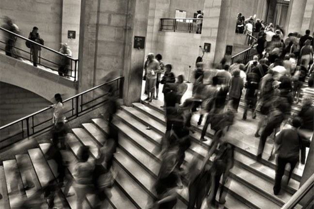 Crowd of people walking on stairs