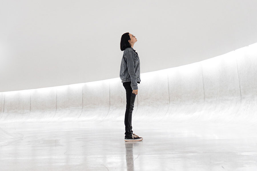 Woman looking up at ceiling