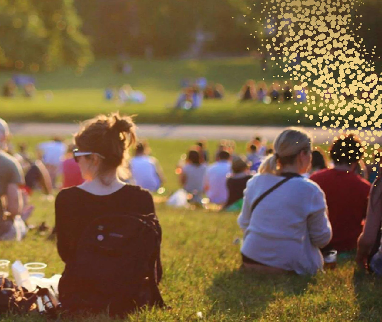 People sitting outside at a park