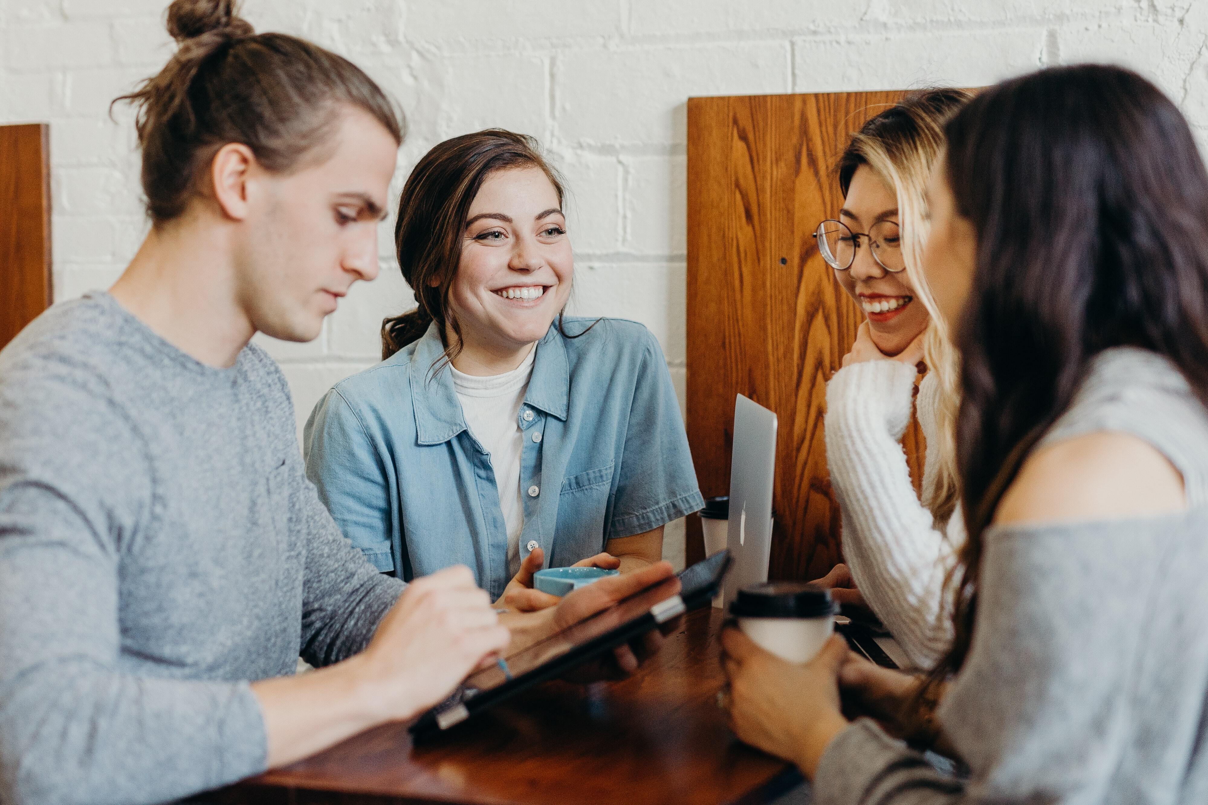 a group of people working happily together