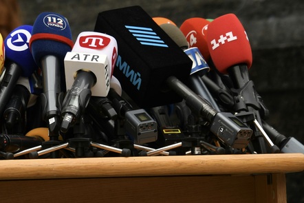 A collection of microphones arranged ready for an interview