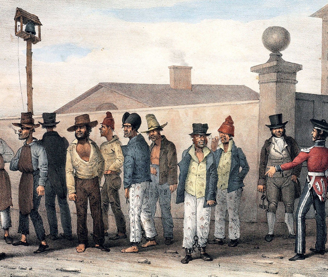 A group of convicts standing along a wall