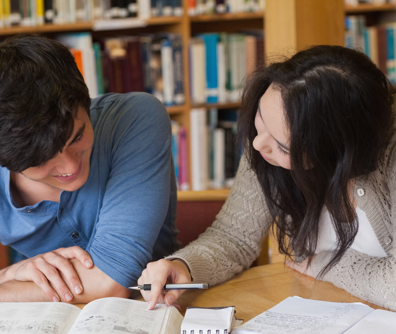 Two students are studying in a classroom 