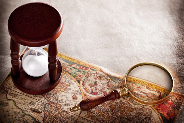 An hourglass, an old map and a compass.