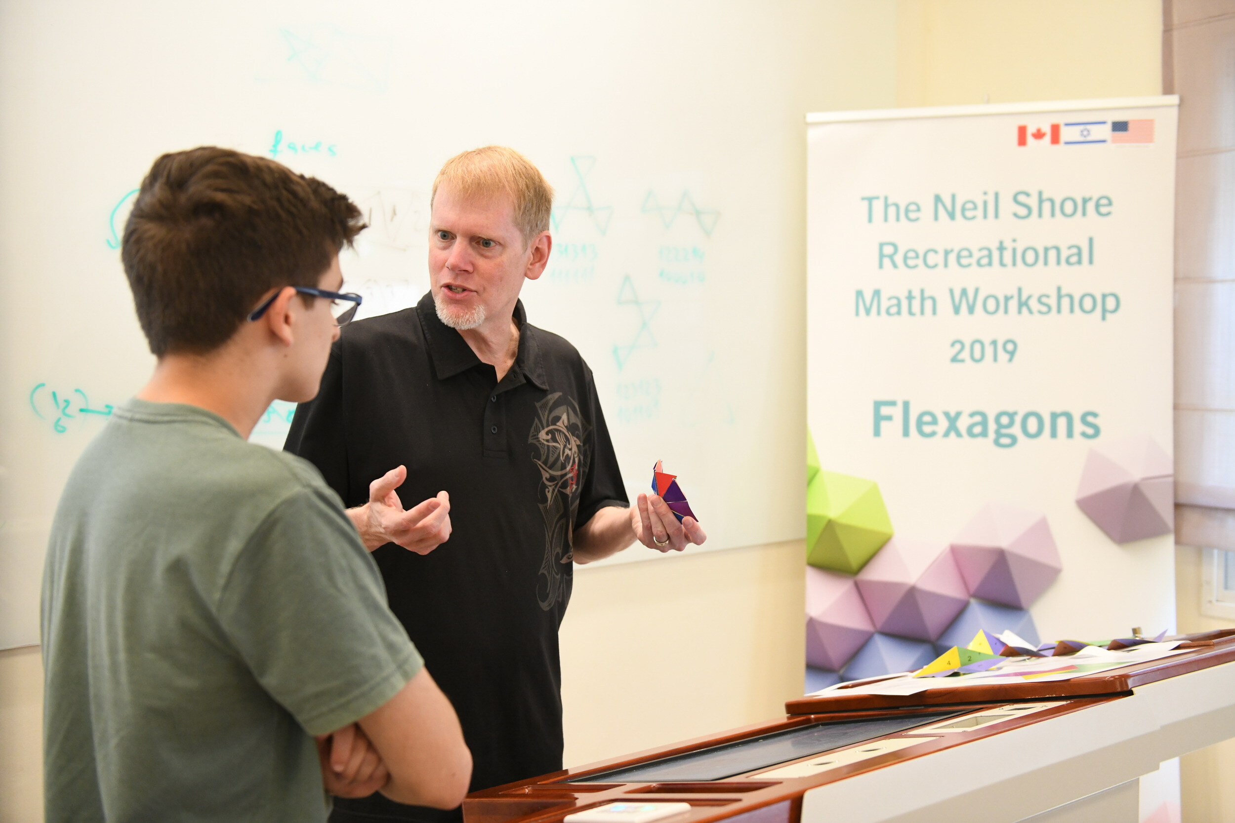 Scott Sherman (center)  at the Neil Shore Recreational Math Workshop in Israel in 2019