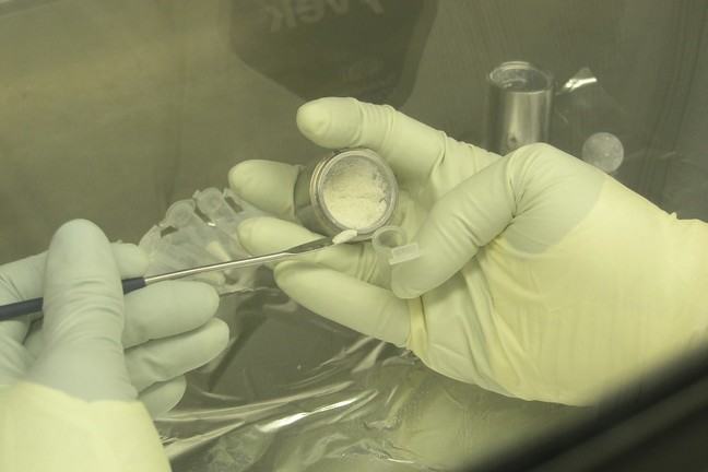 Forensic anthropologist collecting samples