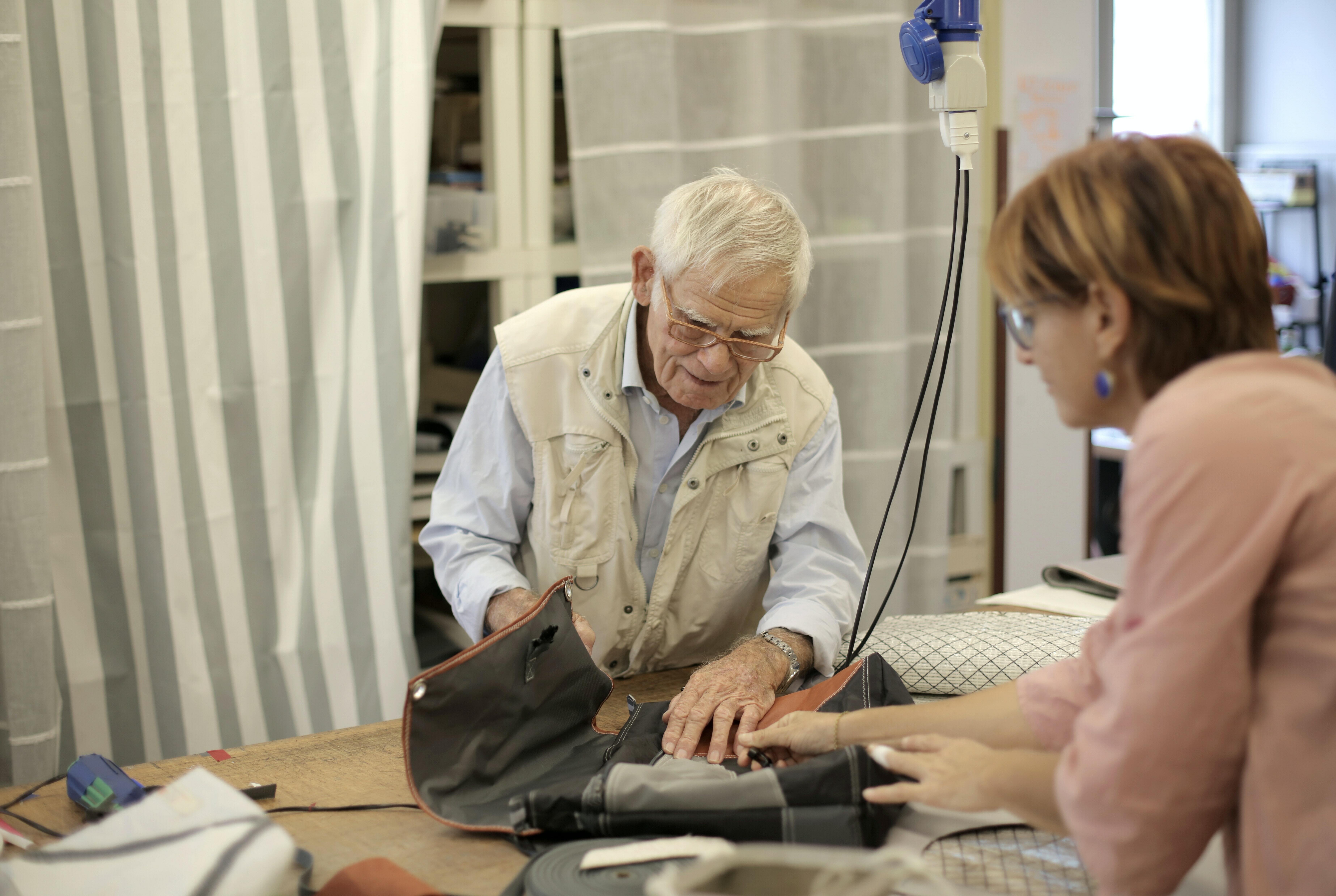 Professional explaining to patient how to use a piece of equipment