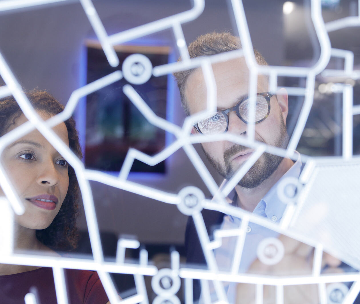 Business people looking at a futuristic digitally generated display