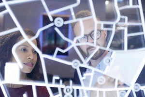 Business people looking at a futuristic digitally generated display